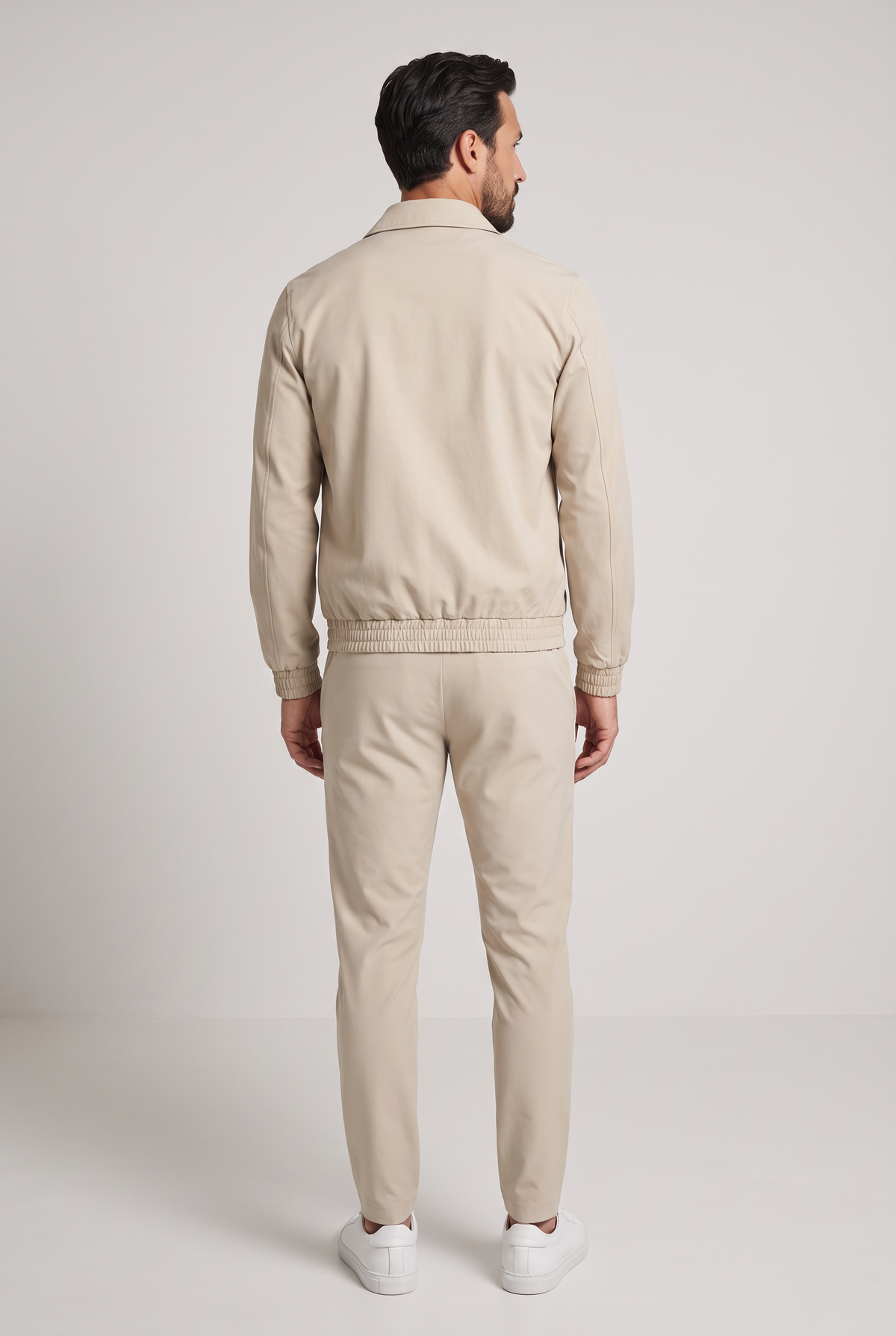 Astos tech suit beige - achterkant