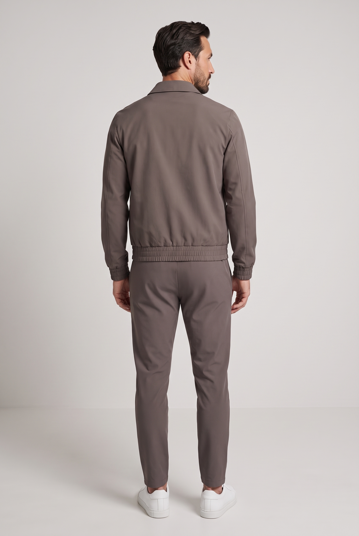 Astos tech suit bruin (taupe) - achterkant