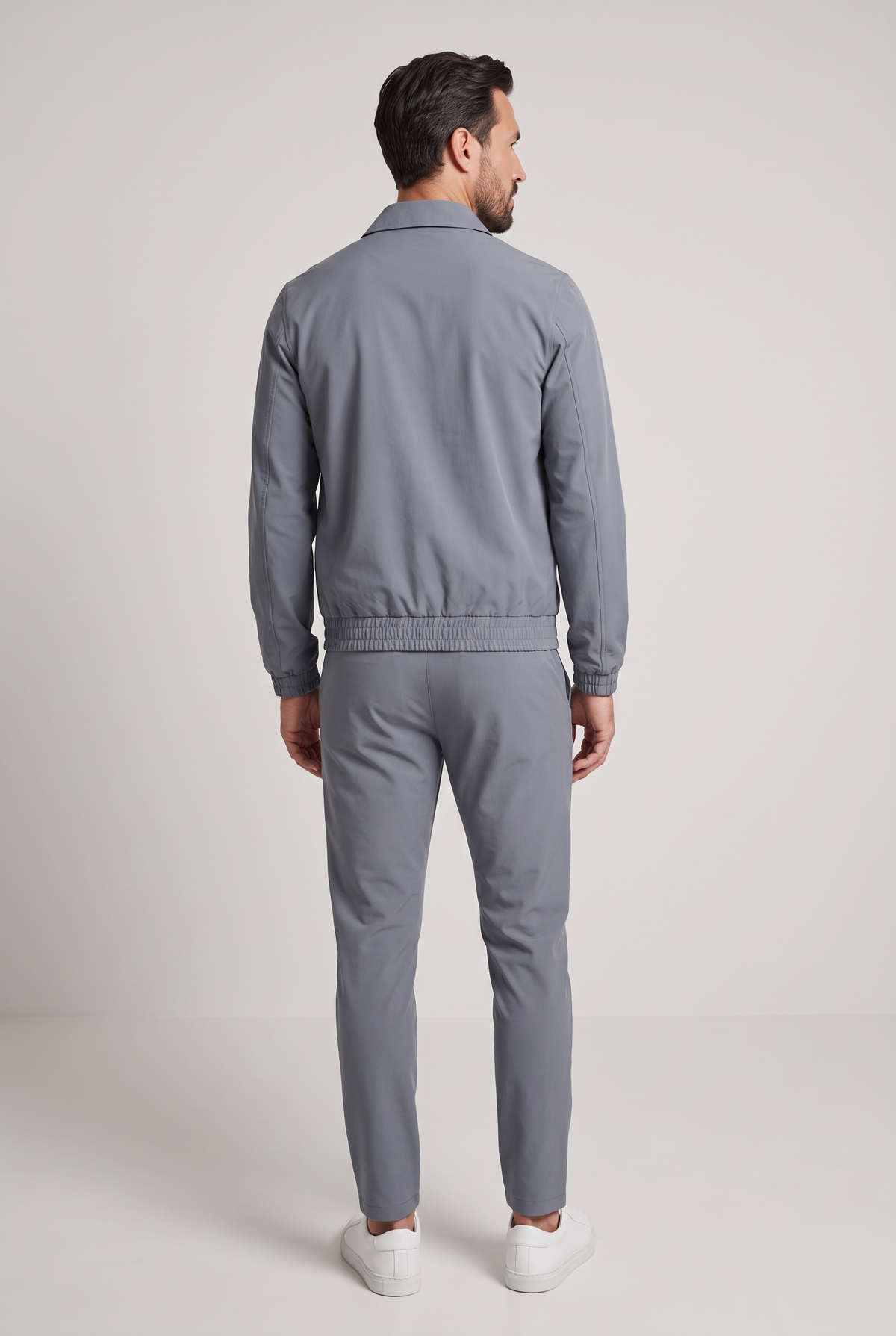 Astos tech suit grijs - achterkant