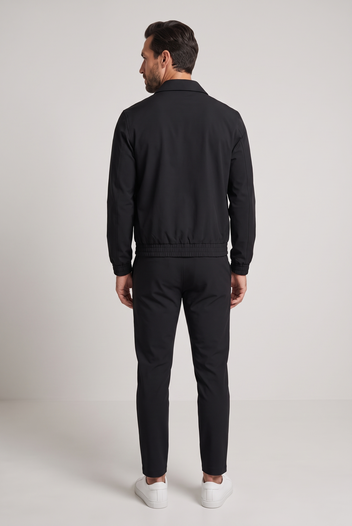 Astos tech suit zwart - achterkant